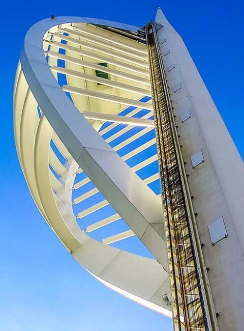 View looking up at Spinakker tower, Portsmouth framed in blue sky, Hampshire