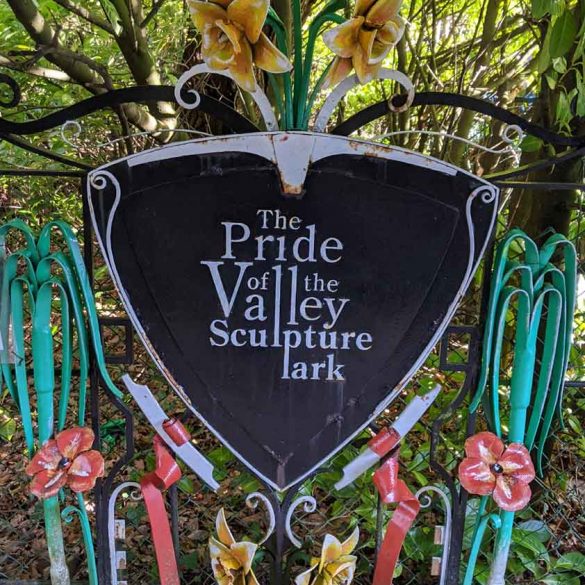 highly decorated metalwork sign for Pride of Valley Sculpture Park, Farnham, Surrey