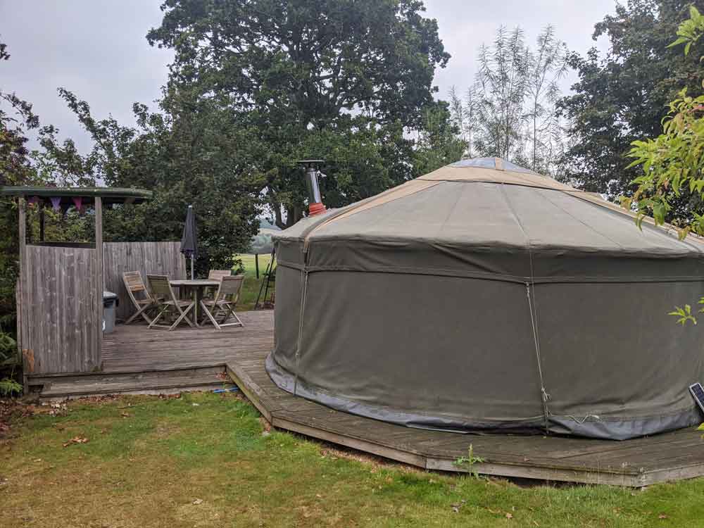 View of Owl Yurt its Kitchen and dining area at Freshwind Farm, Sussex