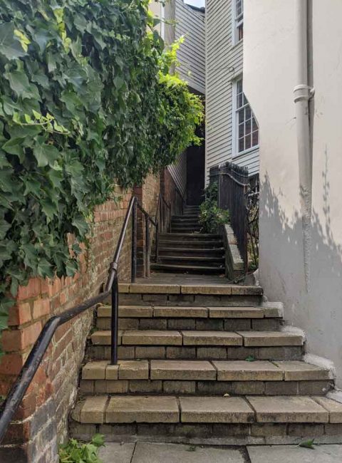 Steep Stairways between houses leading to Smugglers Adventure, Hastings, Sussex