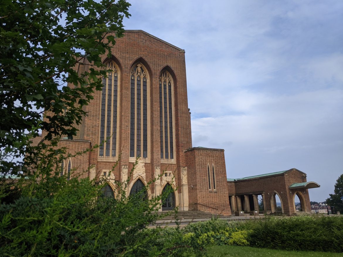 Outside image of Guildford Cathedral with a tree in the foreground