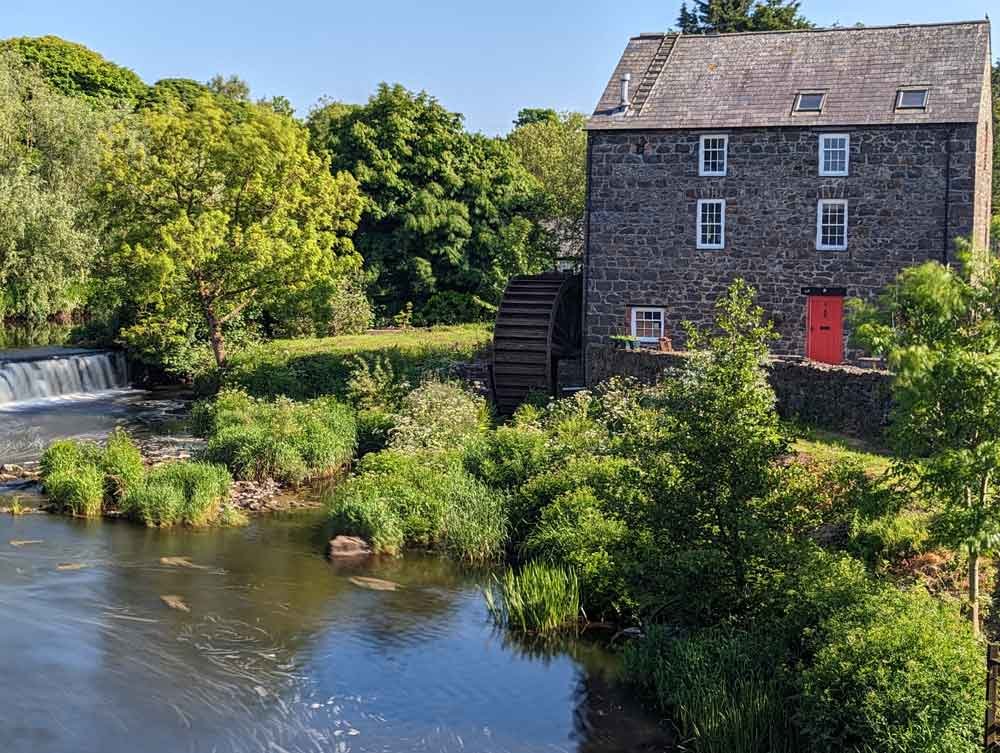 View of the water mill by river Bush, Bushmills, County Antrim, Northern Ireland