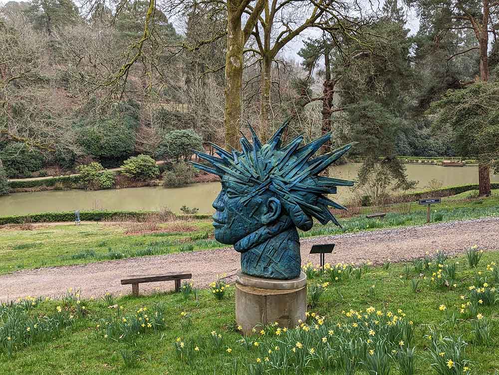 Sculpture of green head with spikes