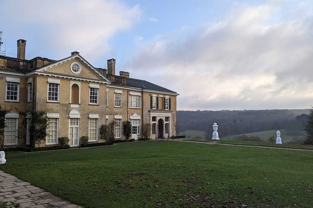 Image of large yellow country houses with views over the Surrey countryside.