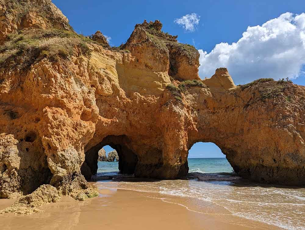 tunnels carved by the sea at Praia dos tres Irmaos, Alvor, Portugal