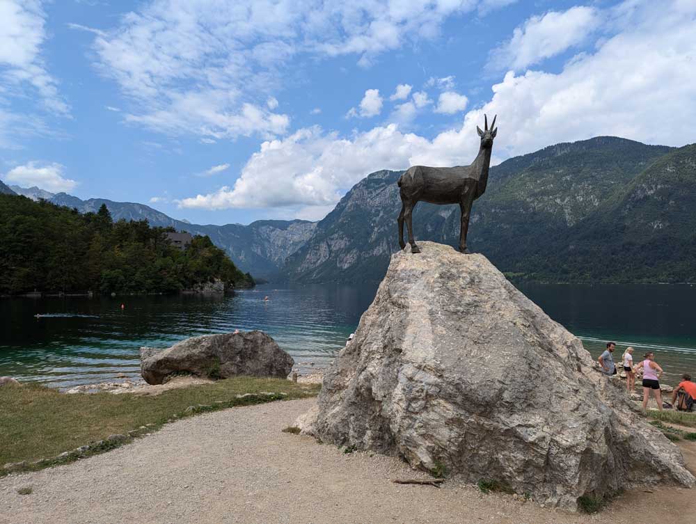 Goldenhorn (Zlatorog) statue in front of Lake Bohinj, Slovenia