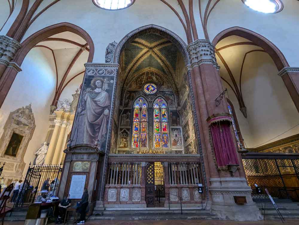 large vaulted ceilings and impressive stained glass windows at Basilica a San Petronio, Bologna, Italy