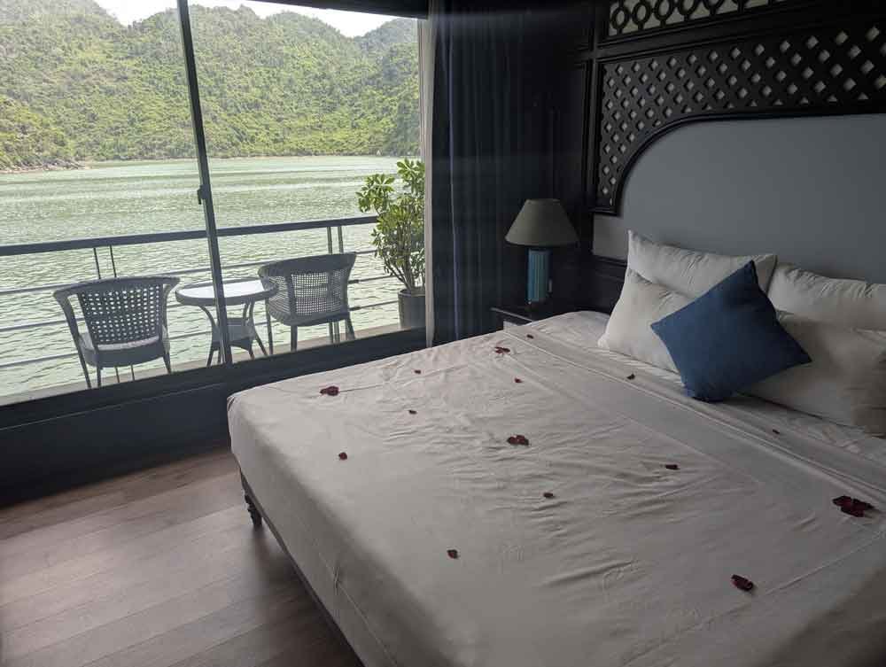 Rose petal covered bed, with views of Lan Ha Bay. Cabin on the Doris Cruise, Lan Ha Bay, Vietnam