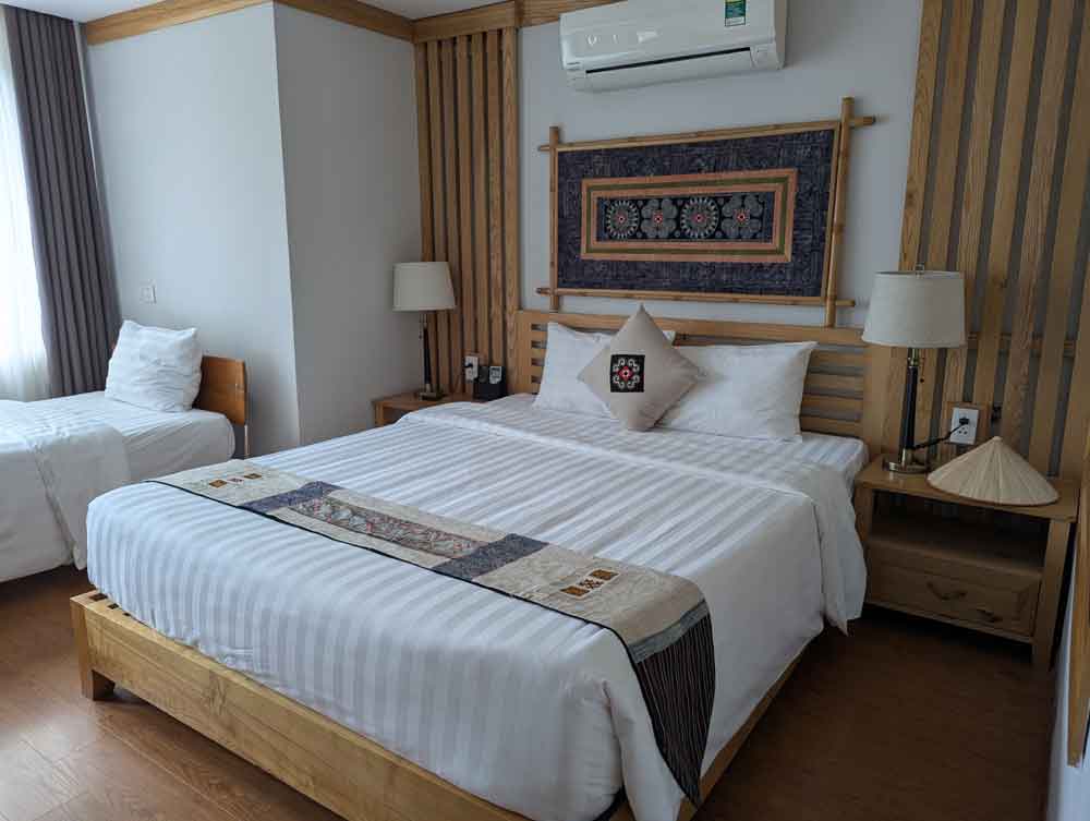 Double bed and single in family room Highlands Hotel Sapa