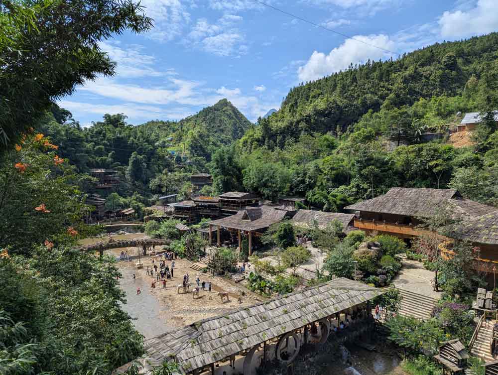 Views over Cat Cat village, Sapa, Vietnam with scenes of river running through valley