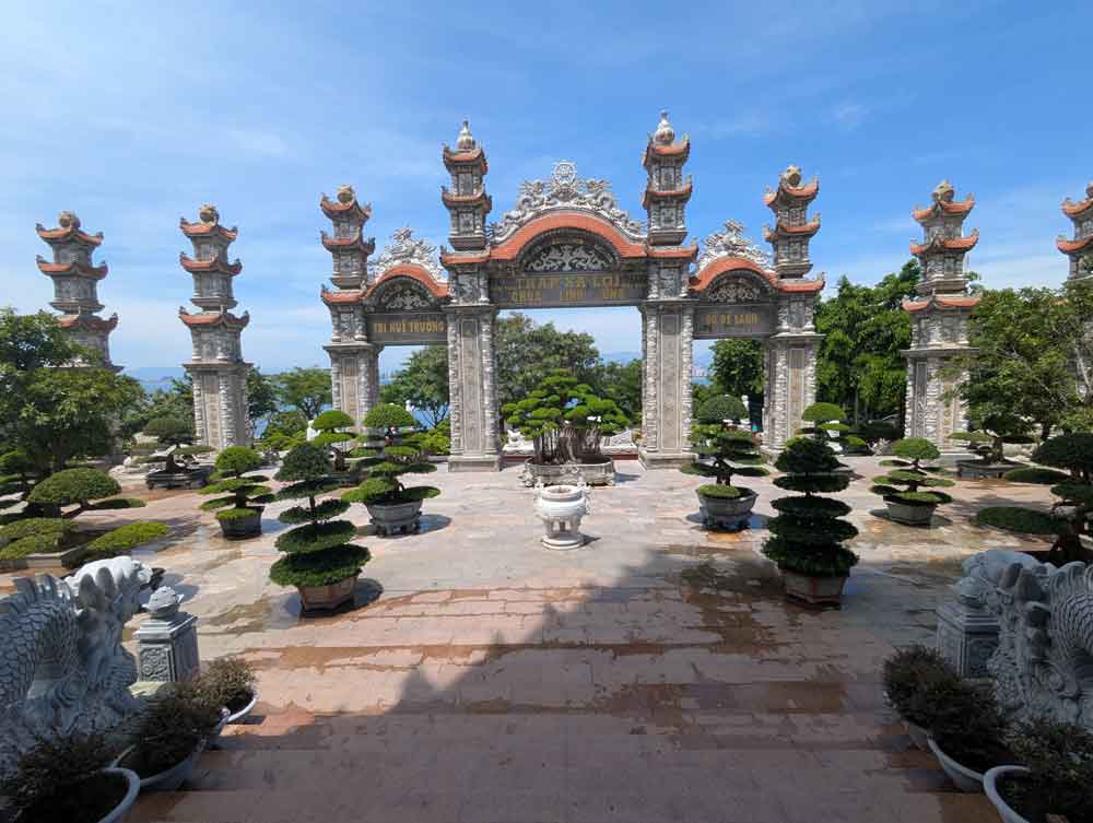 Linh Ung Pagoda complex with ornate building and bonsai trees