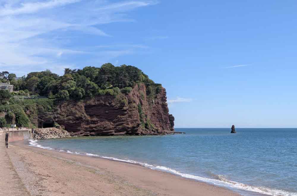 Red sand and cliffs at Teignmouth town beach, South devon