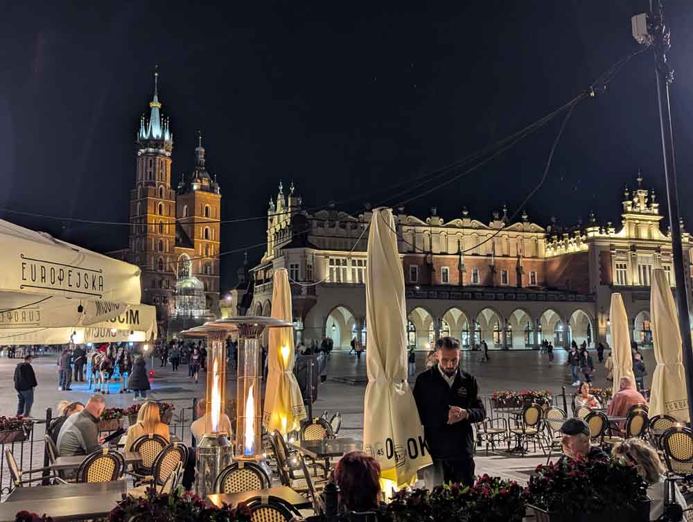 Cafe scene from Krakow market square in the evening