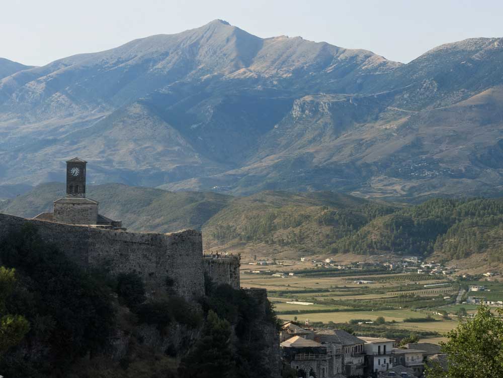 Views of Gjirokaster Castle and valley and mountains in the background