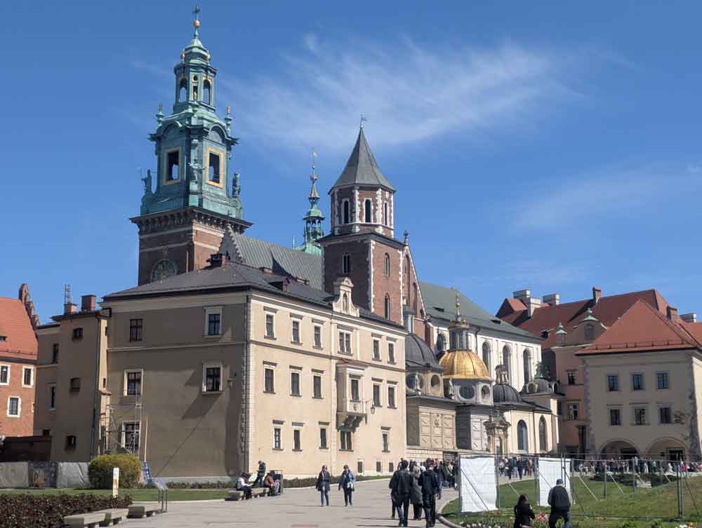 Wawel Castle and courtyard, with tourists in foreground