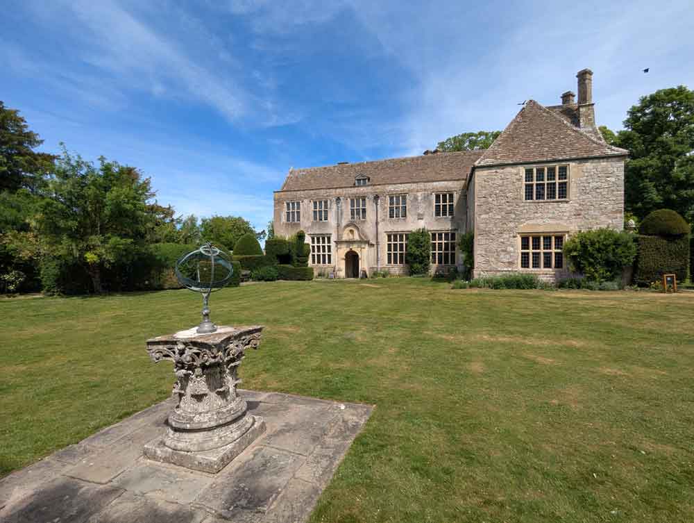 Rear view of Avebury Manor and lawn with sundial, Wiltshire