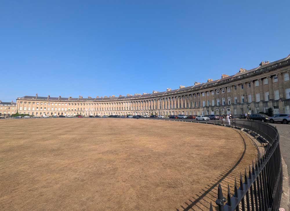 The Royal Crescent - a row of Georgian houses with a dry looking green in front