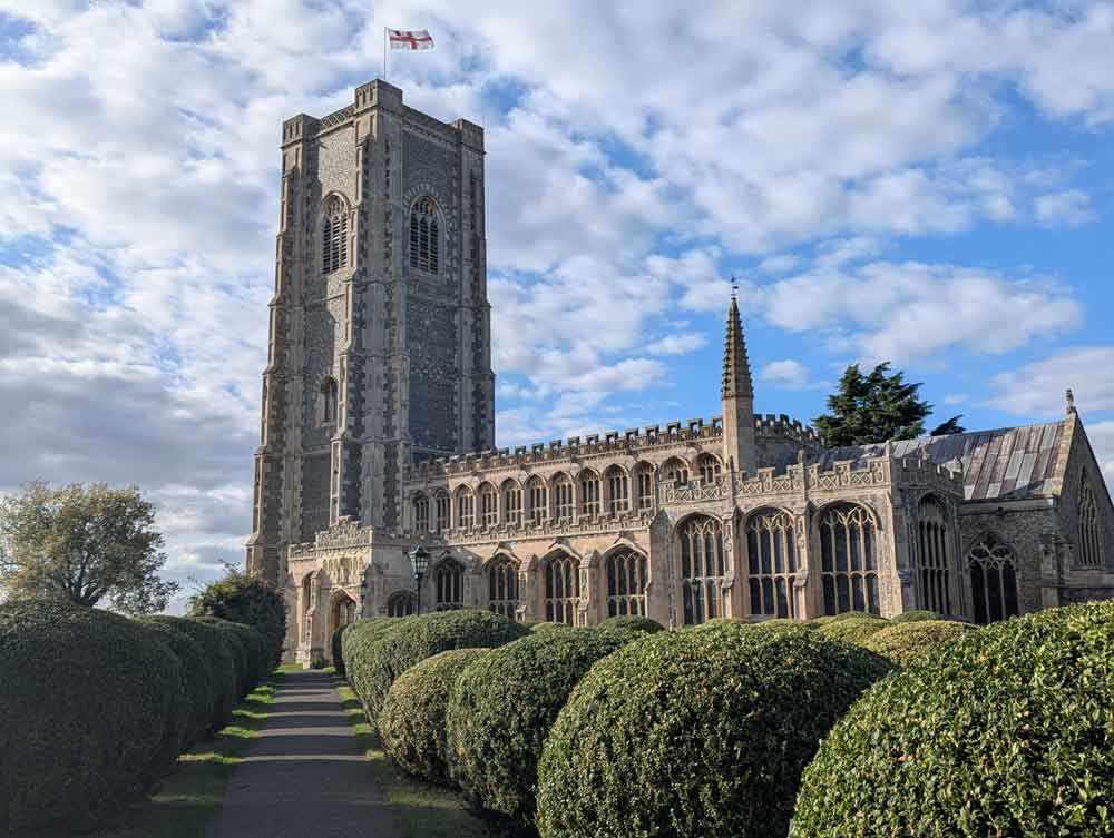 Saint Peter and-Saint Pauls Church, path with round bushes either side leading to the tower.
