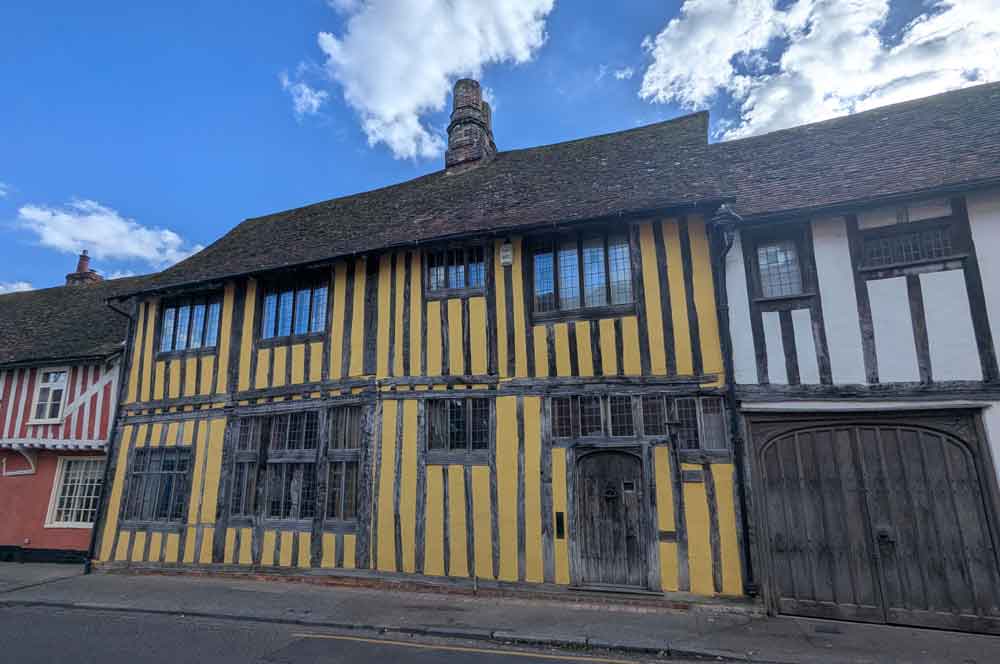 Yellow and white timber-framed medieval houses in Lavenham